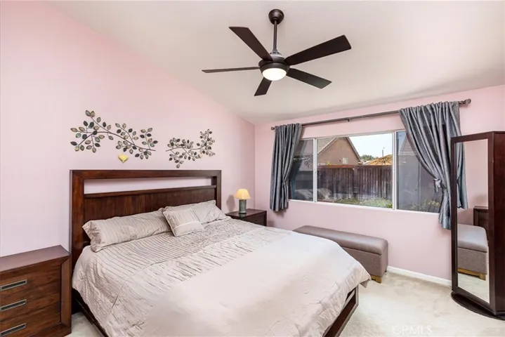 Primary Bedroom with large window looking to back yard.