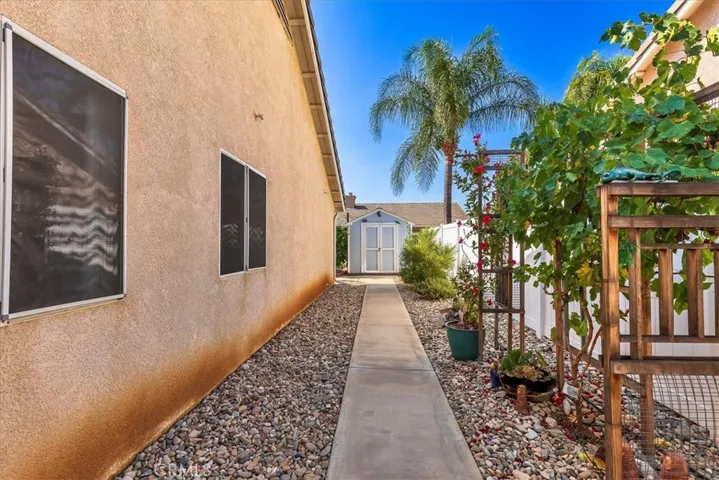 Side yard with storage shed included.