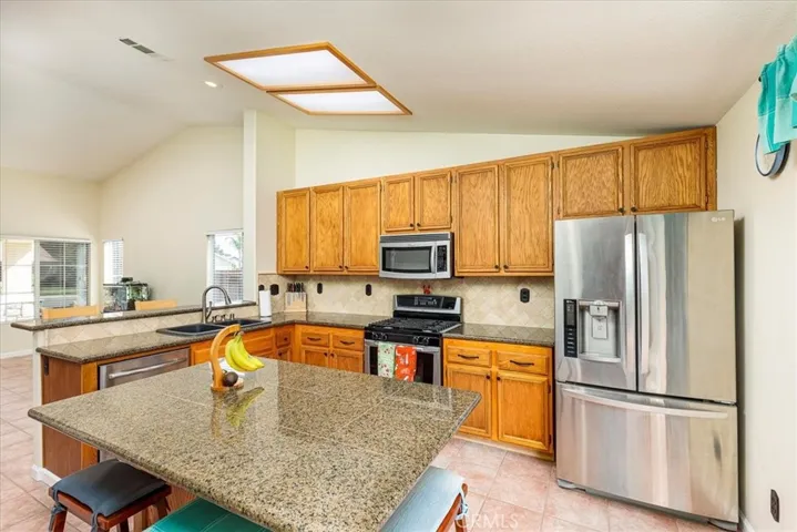 Nicely appointed kitchen open to front living area.