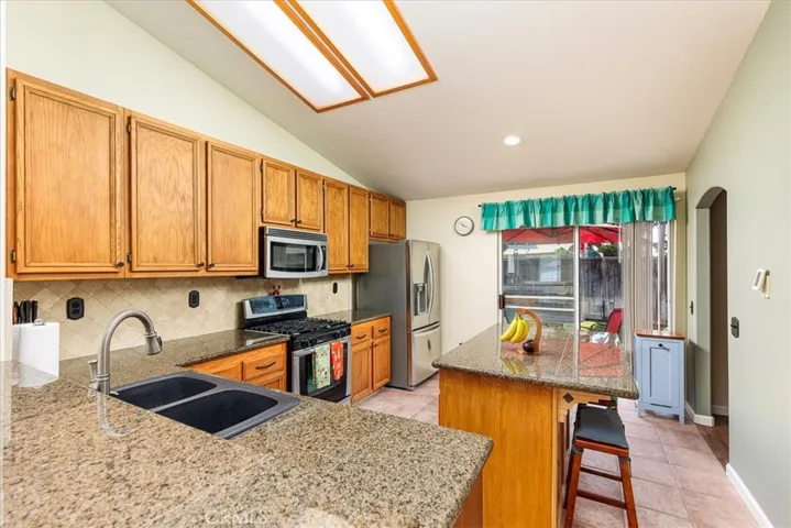 Kitchen with Granite counters, island with room for seating.