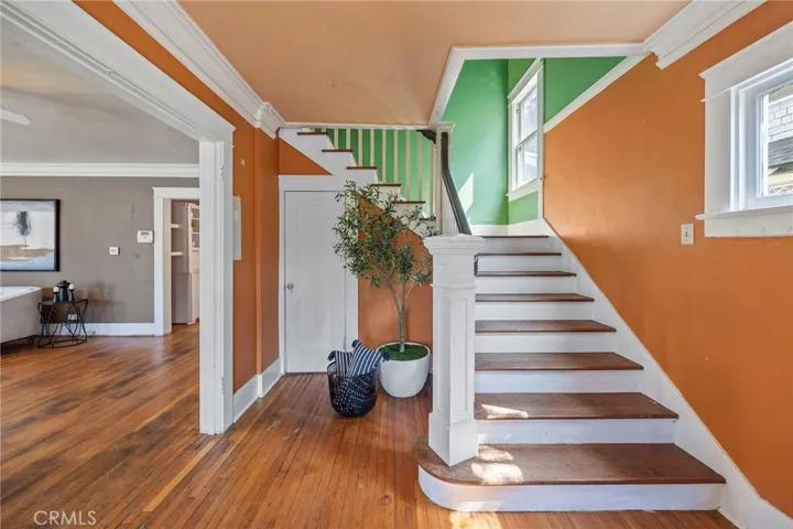 Formal Entry with door to the basement and original wood floors