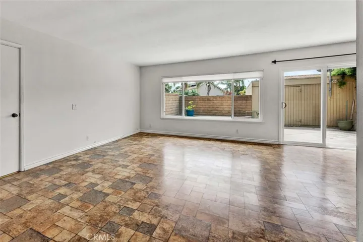 Living area front 
entrance and wall of windows.