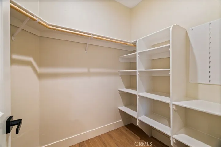 This walk-in closet (one of two) is located just off the Primary Bathroom.