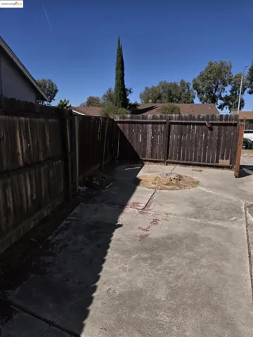 View of fenced backyard