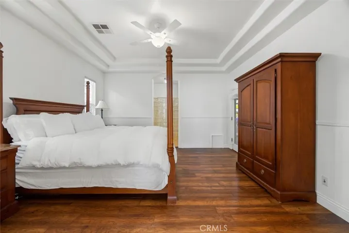 This bedroom has a safe permanently fixed to the floor and has been digitally staged out of the room.