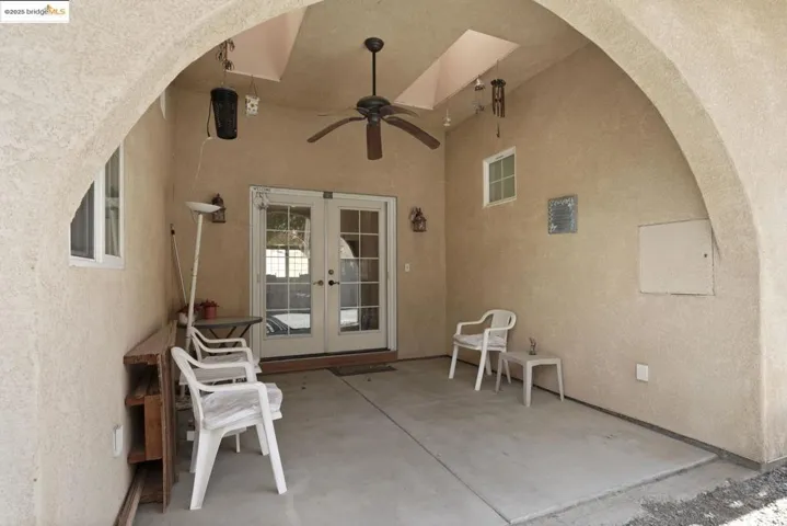 View of patio / terrace with ceiling fan and french doors