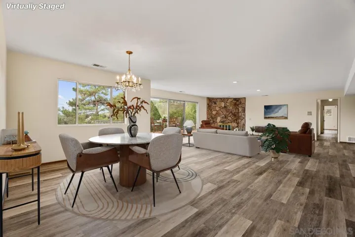 Dining area and livingroom with virutal staging.