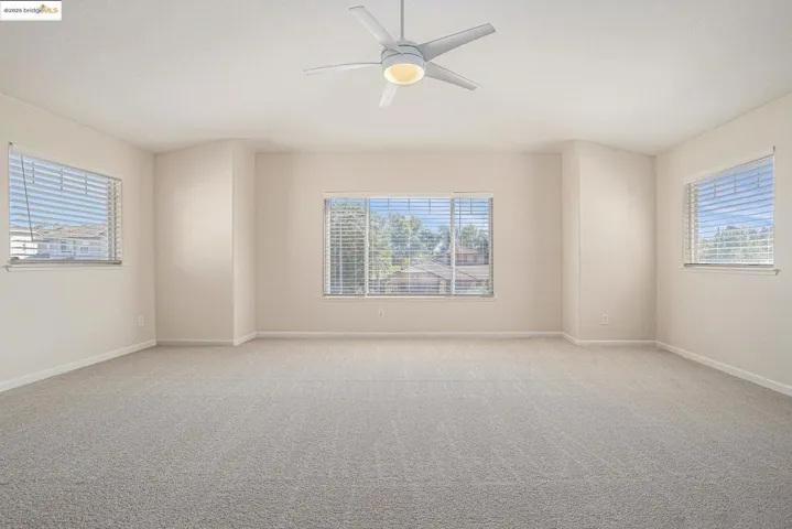 Vaulted ceiling bedroom or bonus room, great for office space, craft room, game room, or entertainment room. Get a peak of Mt. Diablo with ample amount of natural lighting.