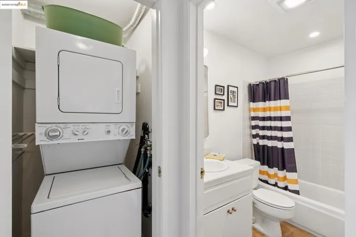 Laundry area featuring stacked washer and clothes dryer