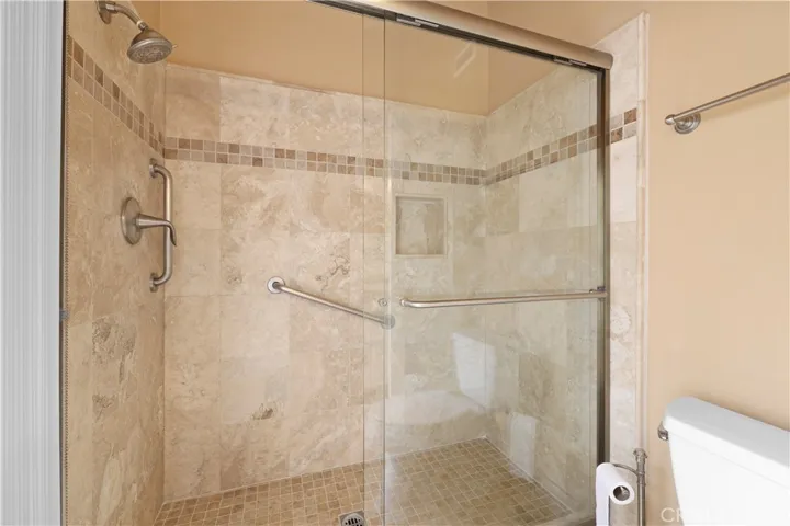 Walk-in shower in the primary bathroom.