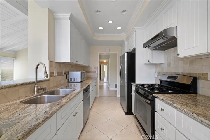 Plenty of room for more than one person to be in the kitchen preparing meals.