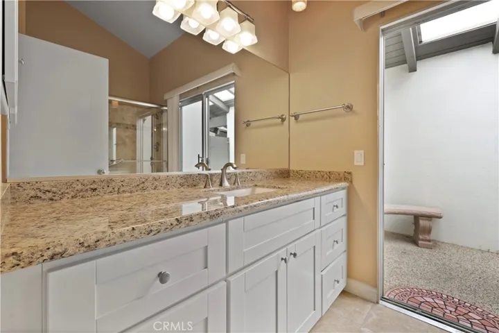 Second vanity with plenty of storage in the primary bathroom.