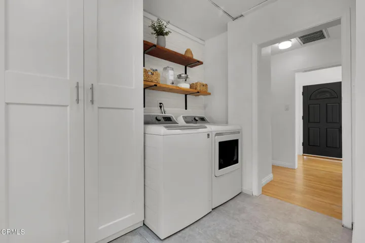 Indoor Laundry area with open shelving