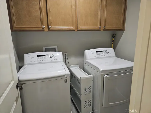Washer and dryer located next to the kitchen.