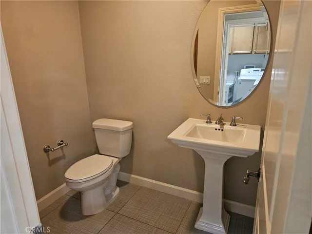 Bathroom located off the kitchen area.