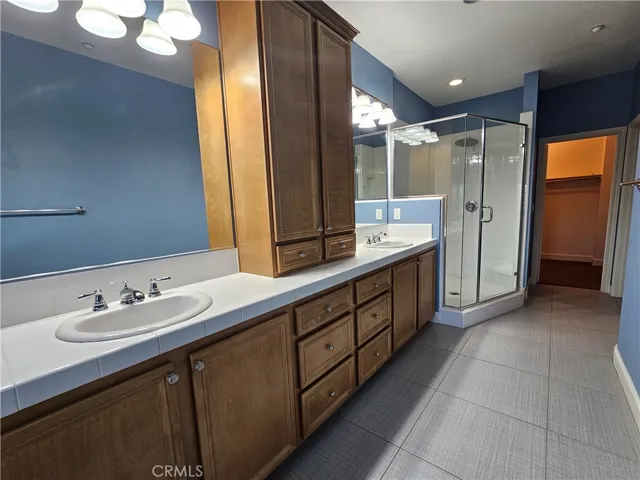 Primary bathroom with dual vanity.