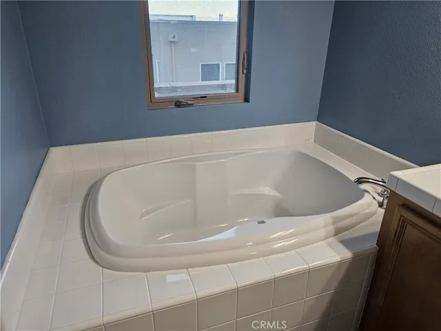 Large soaking tub located in the primary bathroom.