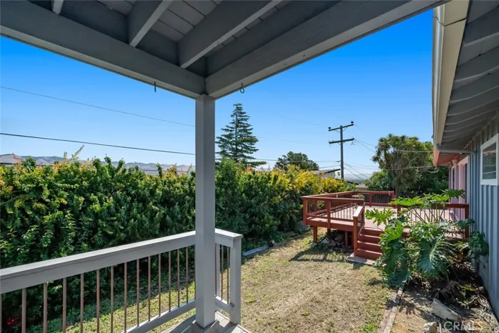 Side door accessing yard from studio