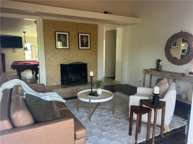Living room with wood burning fireplace.