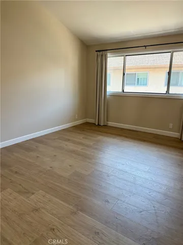 Primary Bedroom with new blinds and beautiful window treatments