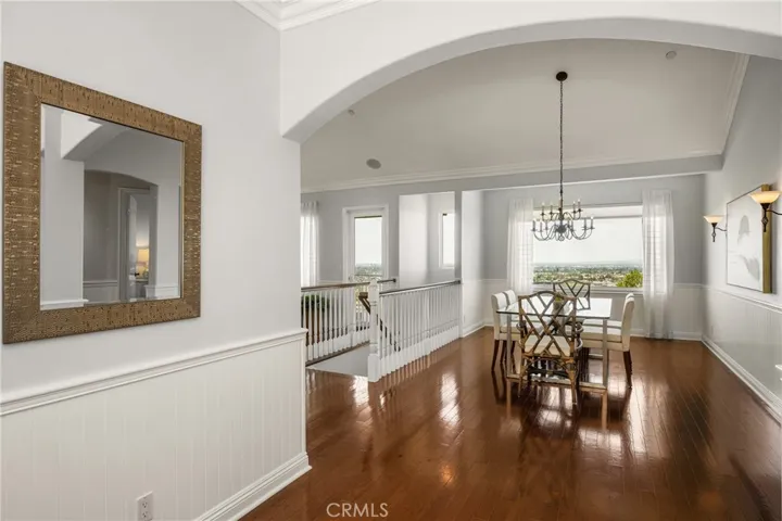 The dining and gathering room naturally flow together under vaulted ceilings.