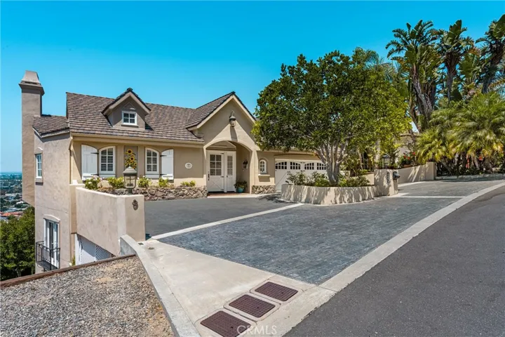 The level driveway allows parking for 4 cars and easy access to your attached two-car garage. Some open off-street parking is available as well.
