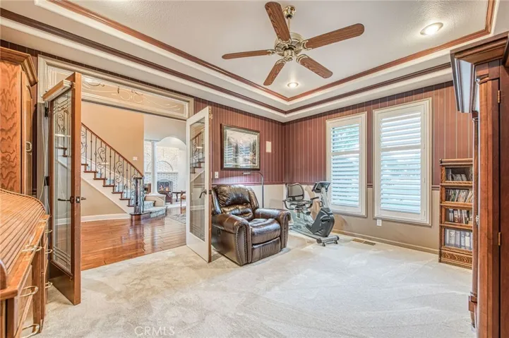 Parlor room with custom french door entry from foyer. coffered cielings and recessed lighting.