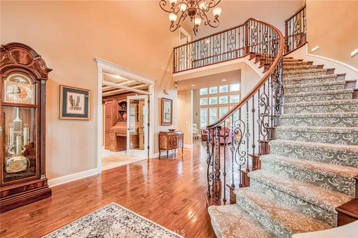 Foyer and staircase from front door, looking toward study and livingroom