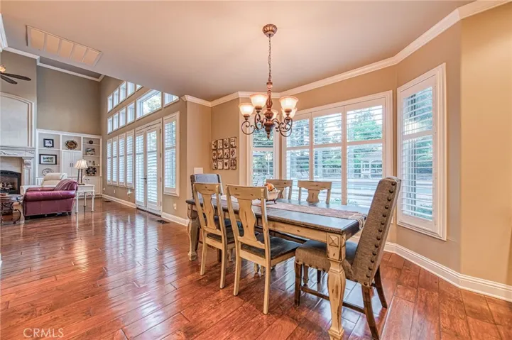 Informal dining area at bay window, showing proximity to the living room