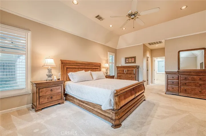 Primary suite showing entry to recently renovated en-suite bathroom and walk-in closets