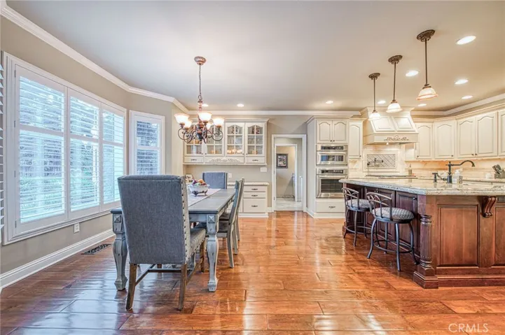 Informal dining area at bay window with views of back yard