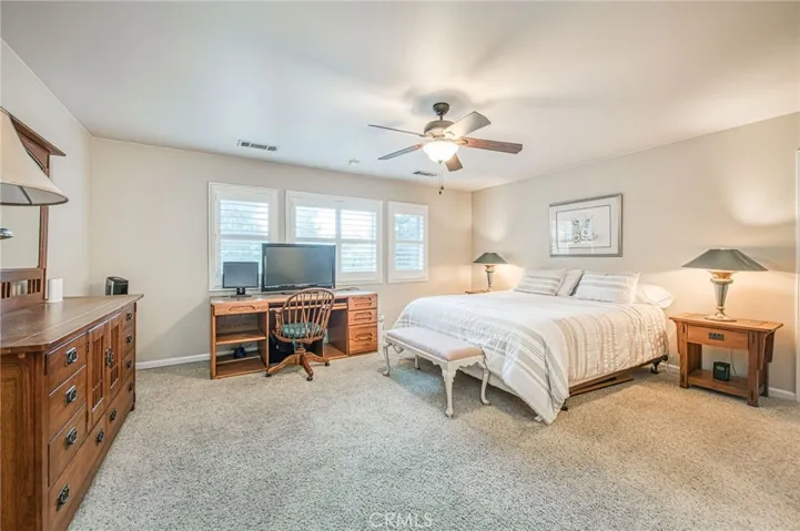 Bedroom 3 upstairs with views of back yard and pool area. Oversized room, with access to jack and jill full bathroom