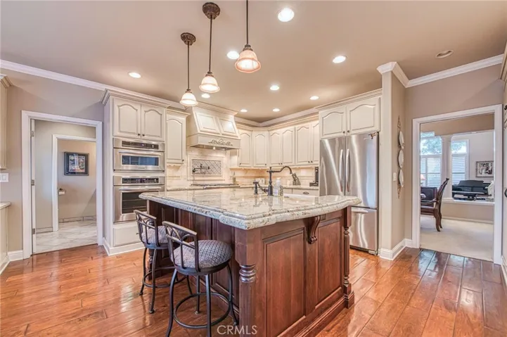 Kitchen island with view of formal dining room and formal living room