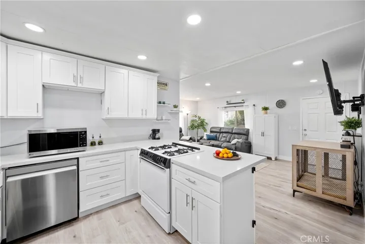 Peninsula in kitchen separating living spaces