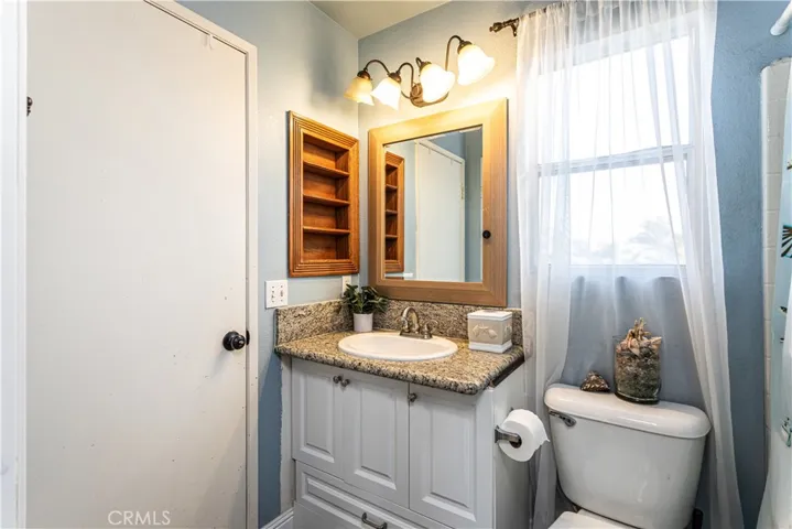 Convenient and updated Jack and Jill bathroom connects two bedrooms.