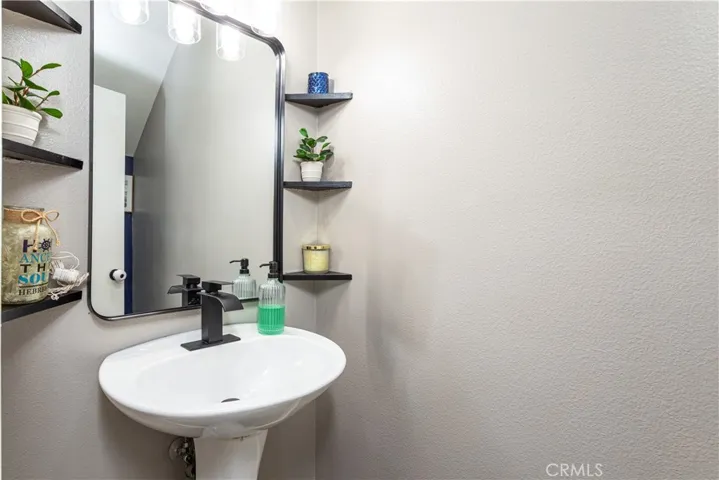 Recently remodeled half-bath is conveniently located on the first floor.