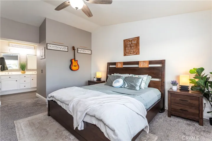 Spacious primary bedroom suite with adjoining double vanity bathroom.