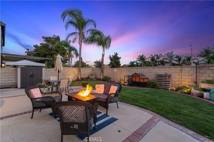 Professionally landscaped backyard at twilight.
