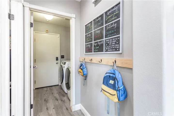 Hallway leading to the laundry room and garage can also be used as a mudroom.