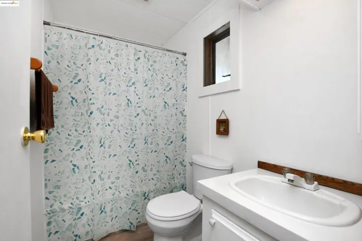 Bathroom with vanity and wood finished floors
