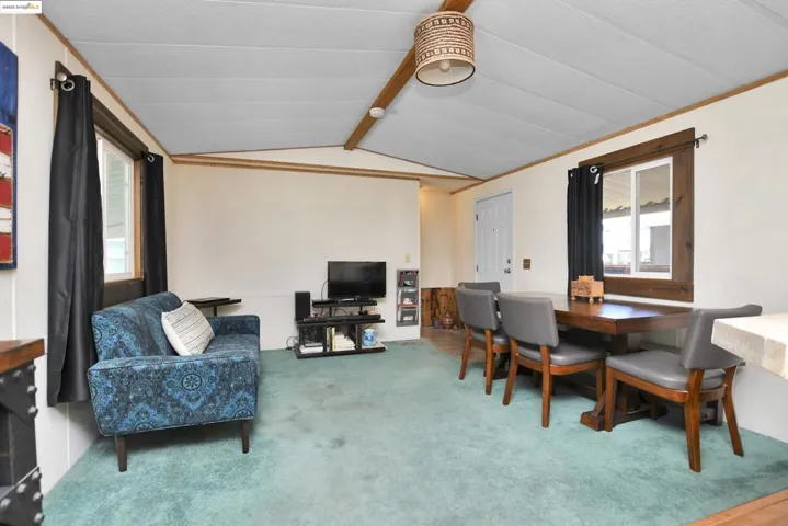 Living area with light colored carpet