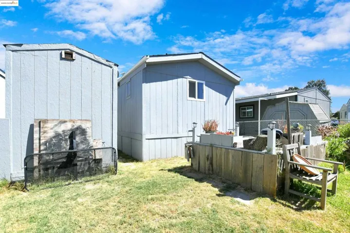 Rear view of property with a sunroom