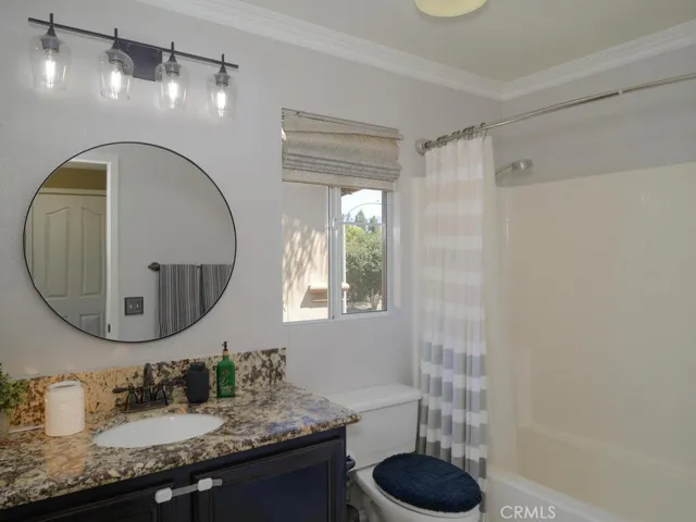 Hall bath with granite counter and tub/shower
