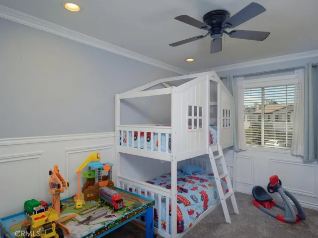secondary bedroom with wainscoting