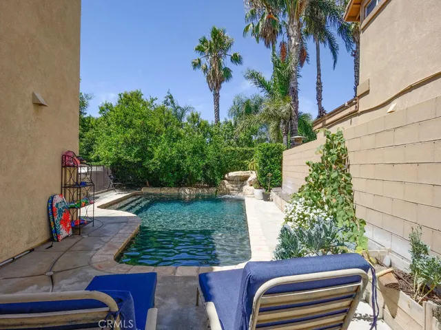 View of private pool area with grotto/waterfall