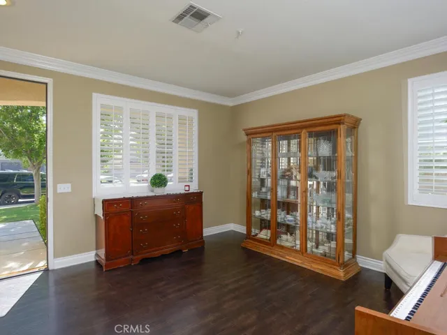Another view of living room and front entry door