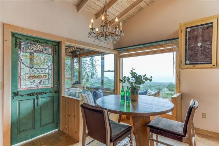 Decorative stained  glass door leads to the enclosed patio