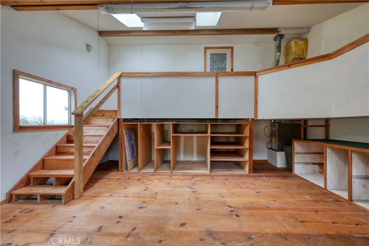 stairs lead up to the door to the living room