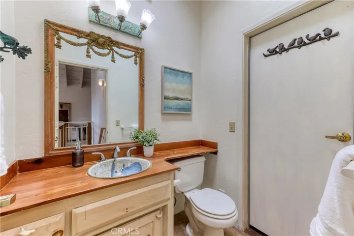 Half bath with door leading to garage/Art Studio