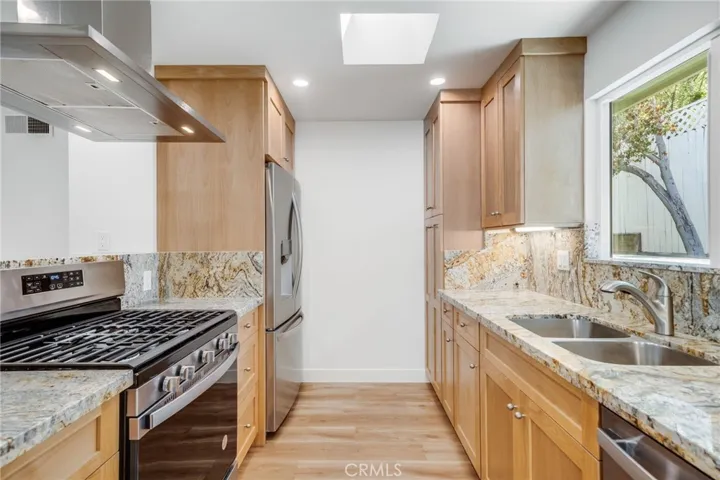 Newly Updated Kitchen:  new appliances, sink, countertop and cabinets